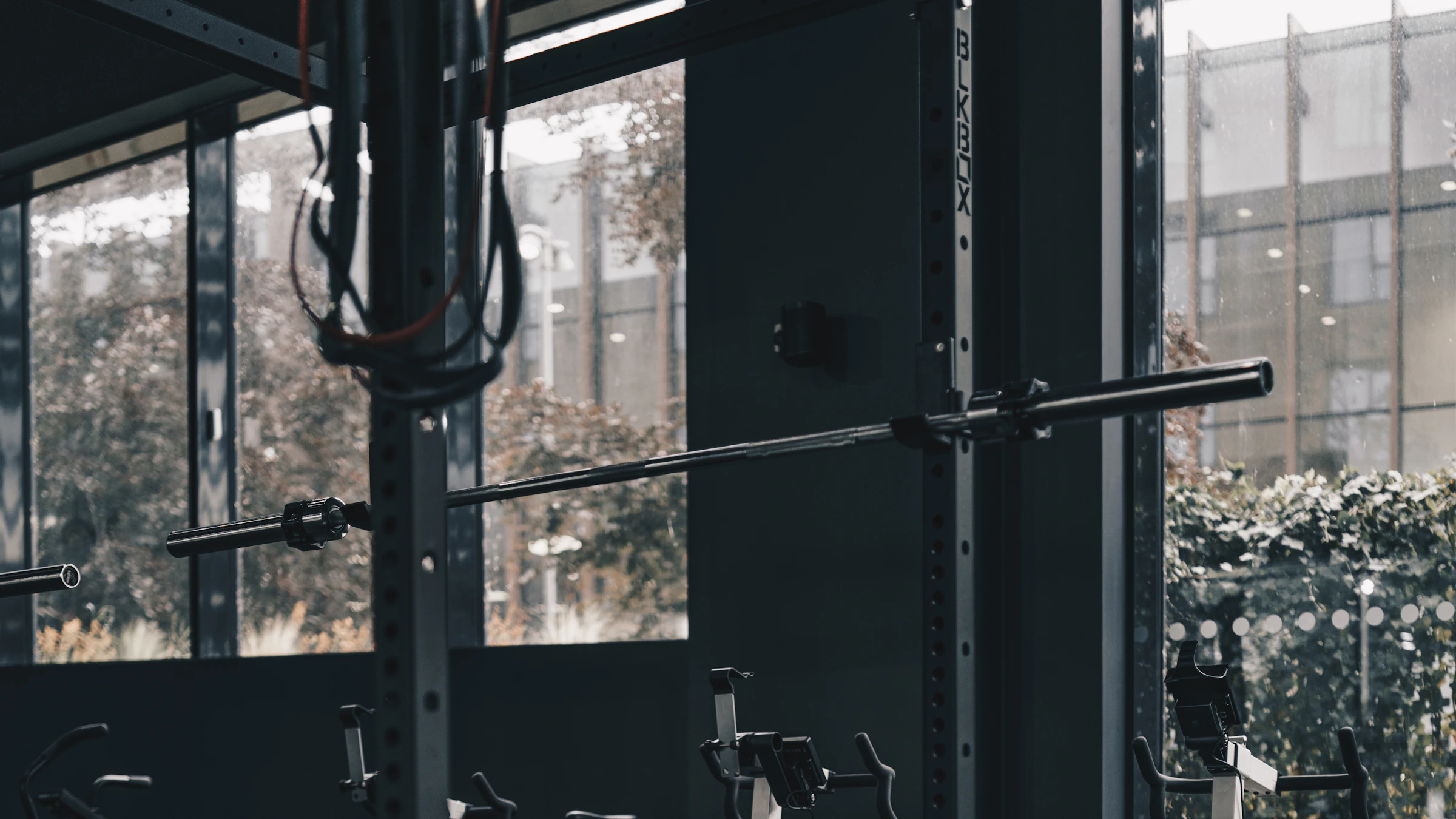 Squat racks and barbells on the strength floor at Xavion Fitness Studio, Thindal, Erode